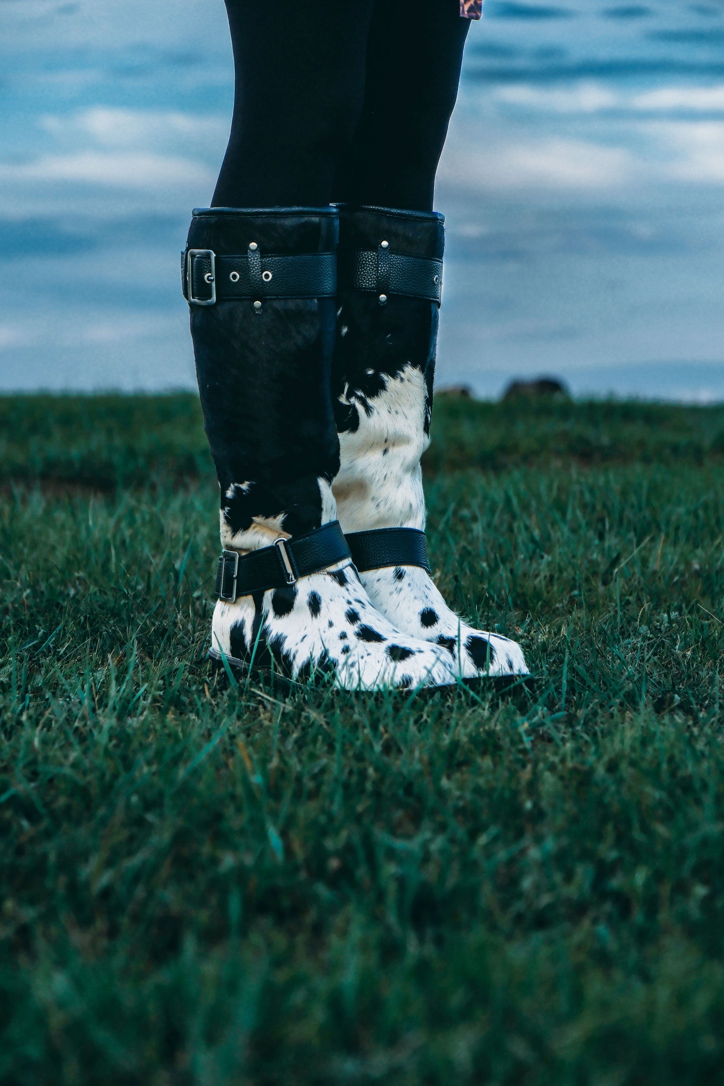 MOGSki handcrafted cowhide snow boots worn on grass, genuine natural hide luxury Mongolian winter footwear lifestyle