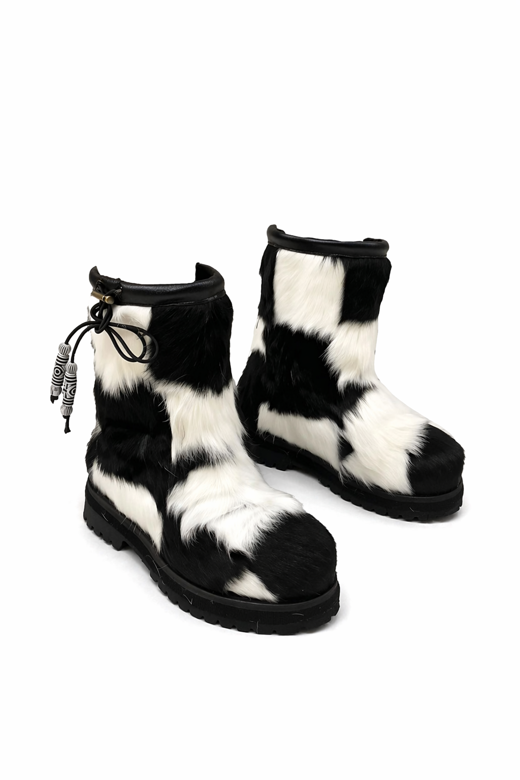 MOGSki natural cowhide fur snow boots on white background, one of a kind pattern, luxury handcrafted Mongolian boots
