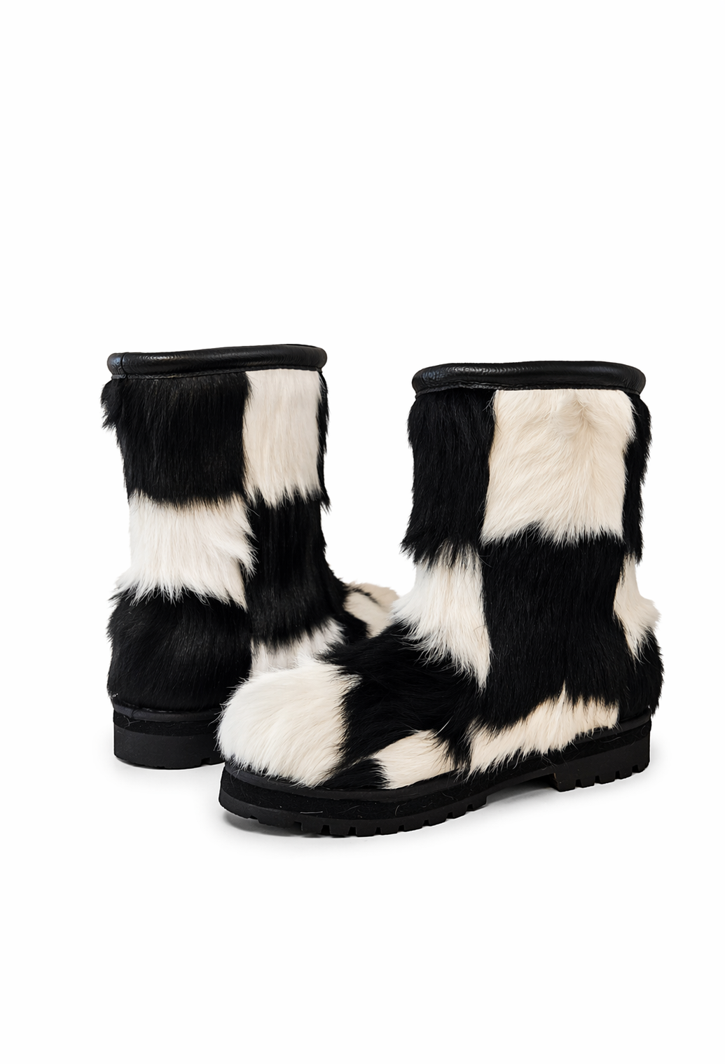 MOGSki natural fur snow boots on white background, genuine sheepskin handcrafted luxury winter boots, product photography