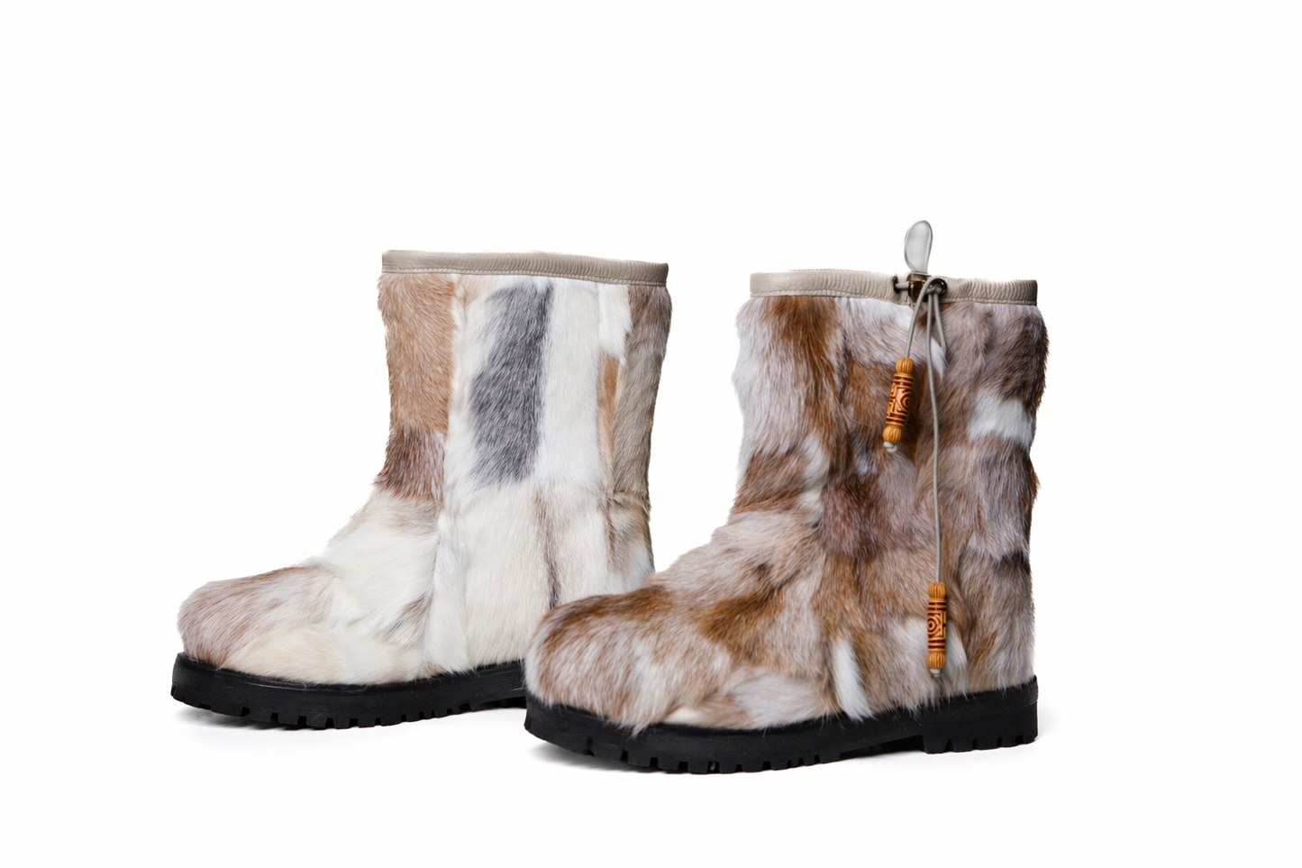 MOGSki natural fur covered snow boots on white backdrop, genuine sheepskin luxury winter footwear product photography