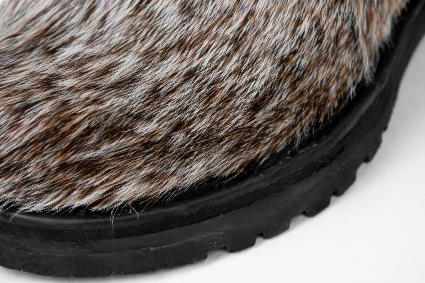 MOGSki boot detail showing natural fur upper and anti-slip rubber sole, luxury handcrafted Mongolian winter footwear construction