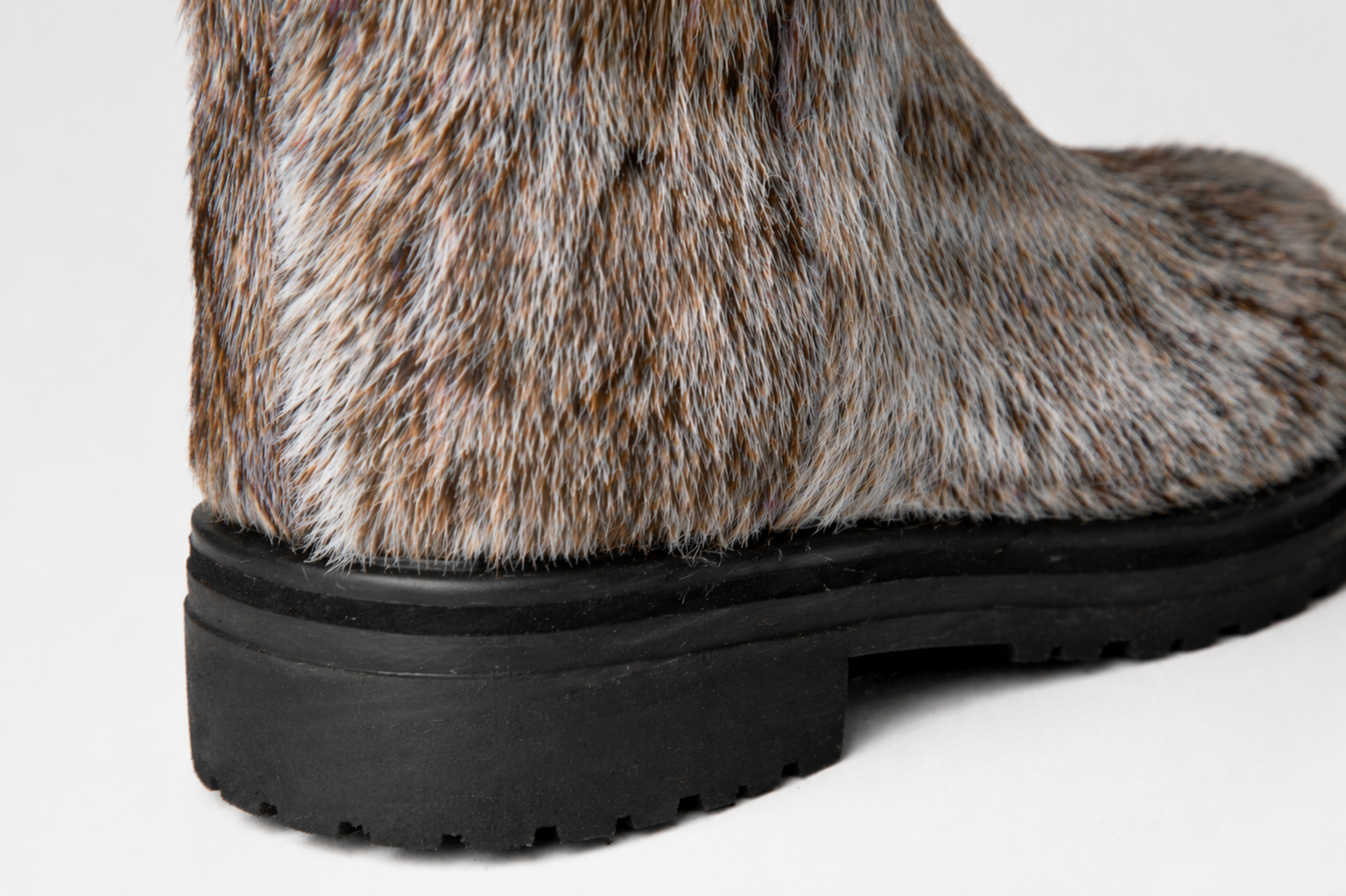 MOGSki boot heel detail showing natural fur texture and durable outsole, luxury handcrafted winter footwear Inner Mongolia