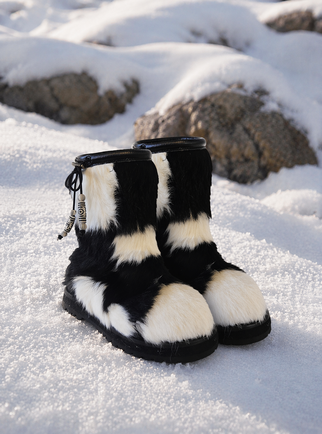 MOGSki natural fur snow boots in winter landscape, genuine sheepskin luxury cold weather boots, handmade in Mongolia
