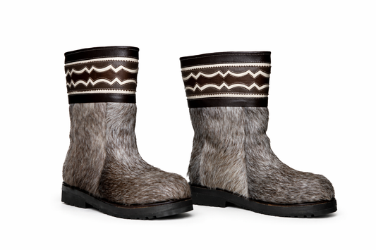 MOGSki handcrafted fur winter boots on clean white background, natural hide luxury footwear product photography Mongolia