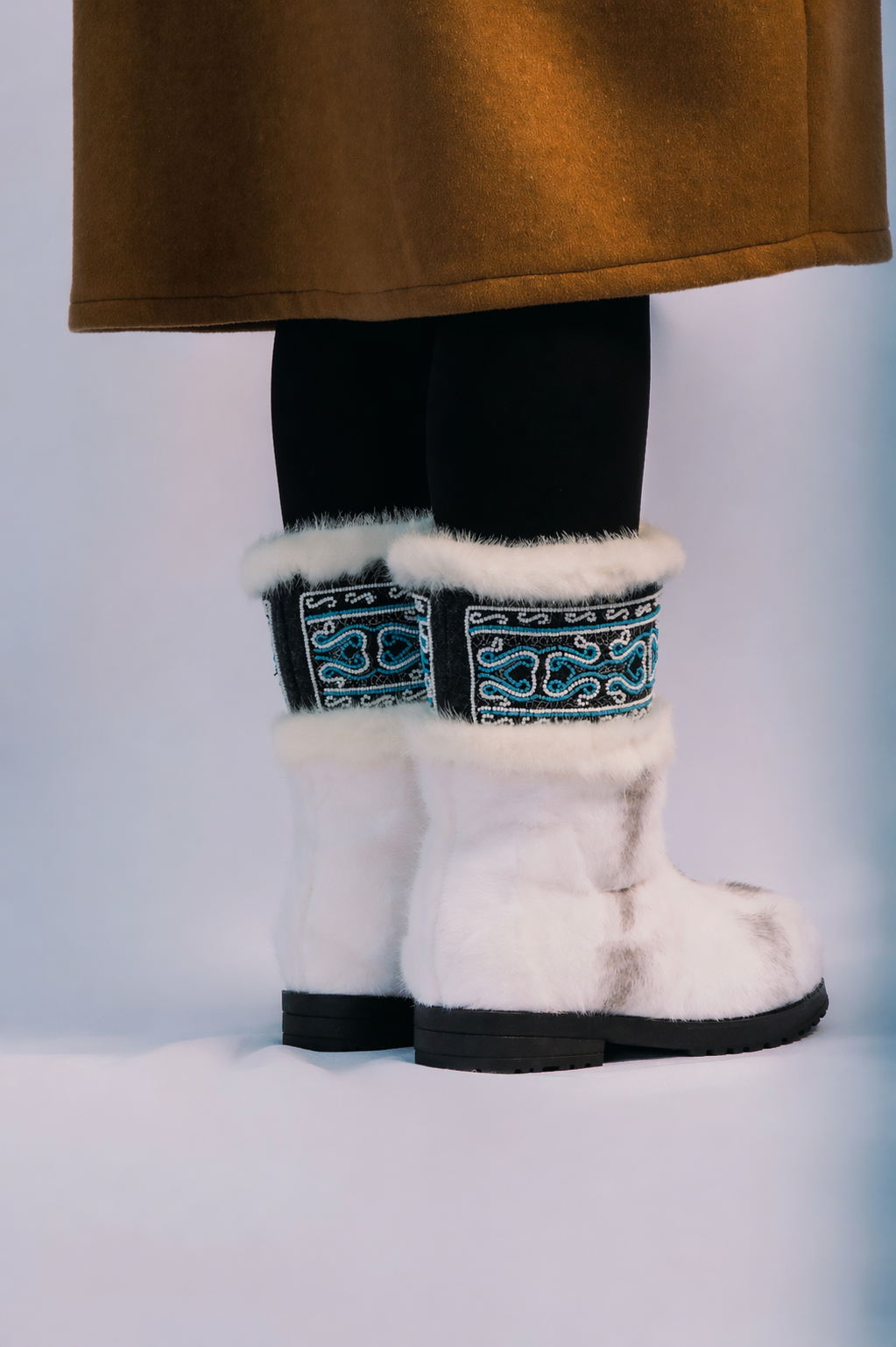 MOGSki white mink fur snow boots with traditional Mongolian embroidered cuffs, luxury handcrafted winter footwear worn