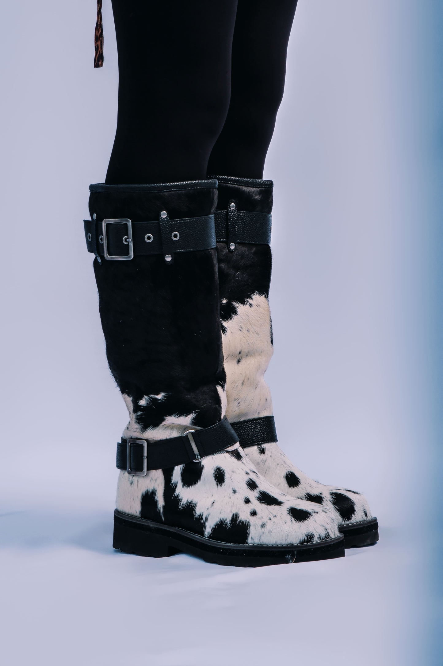 MOGSki natural cowhide boots worn with black outfit, luxury handcrafted Mongolian footwear lifestyle photography detail