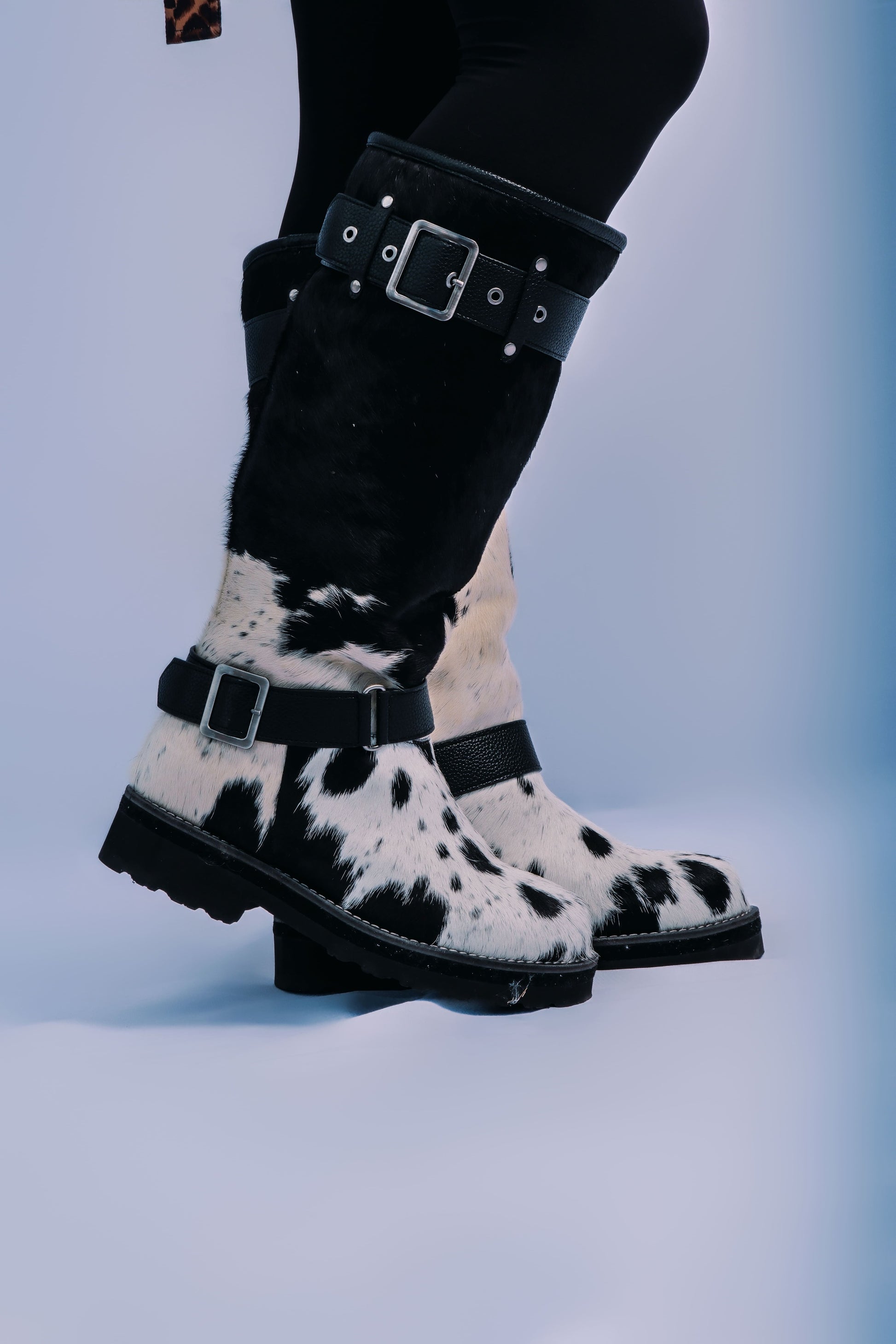 MOGSki handcrafted cowhide boots worn with black trousers outdoors, luxury natural hide Mongolian winter footwear