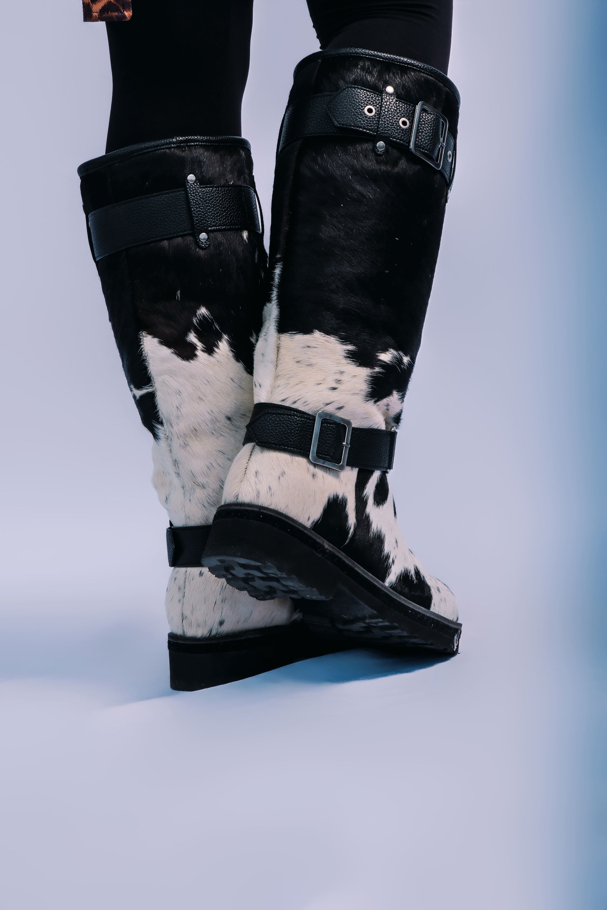 MOGSki handcrafted cowhide boots detail shot, luxury natural hide Mongolian winter footwear product photography