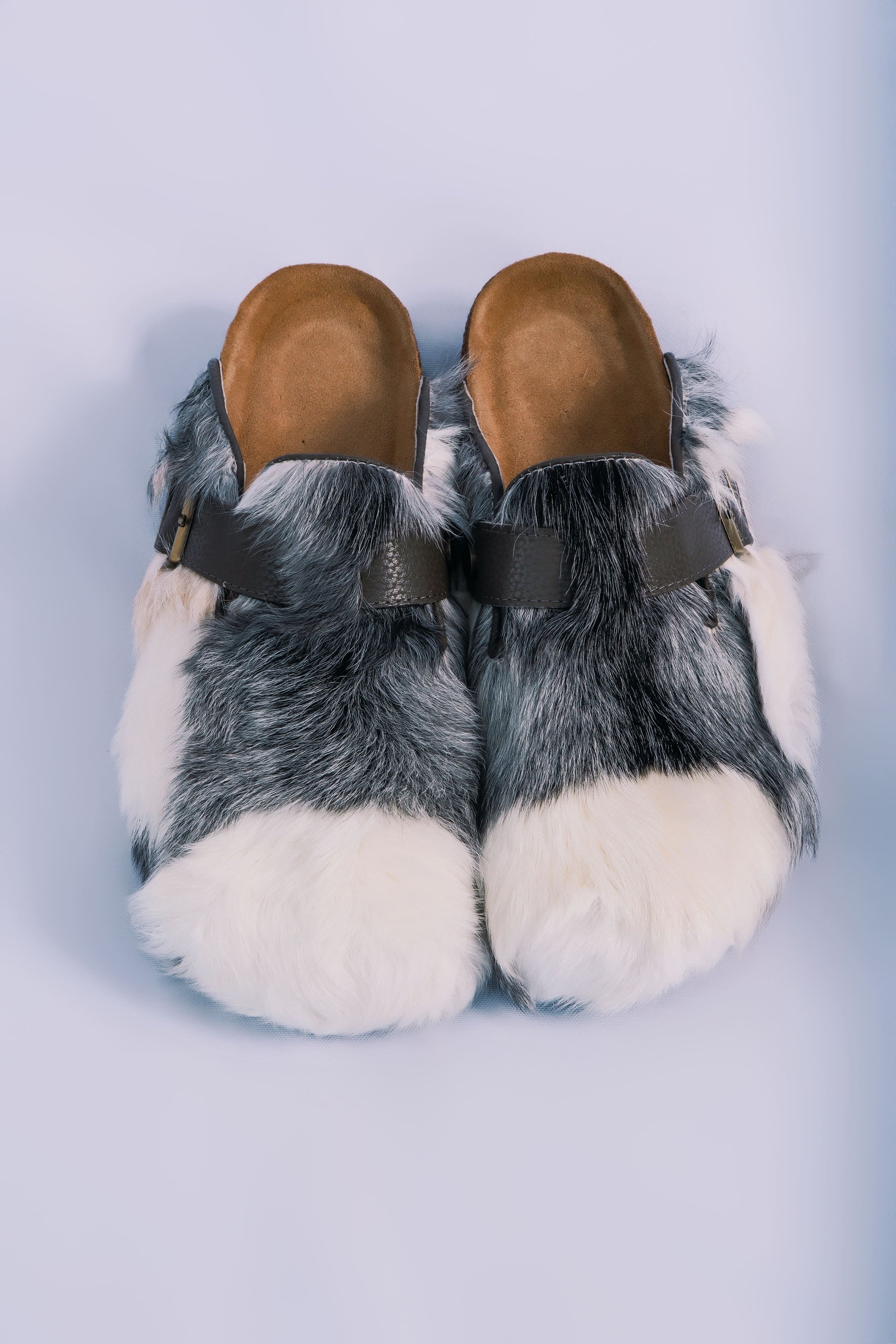 MOGSki natural cowhide fur clogs front view on clean background, luxury handcrafted genuine hide footwear from Inner Mongolia