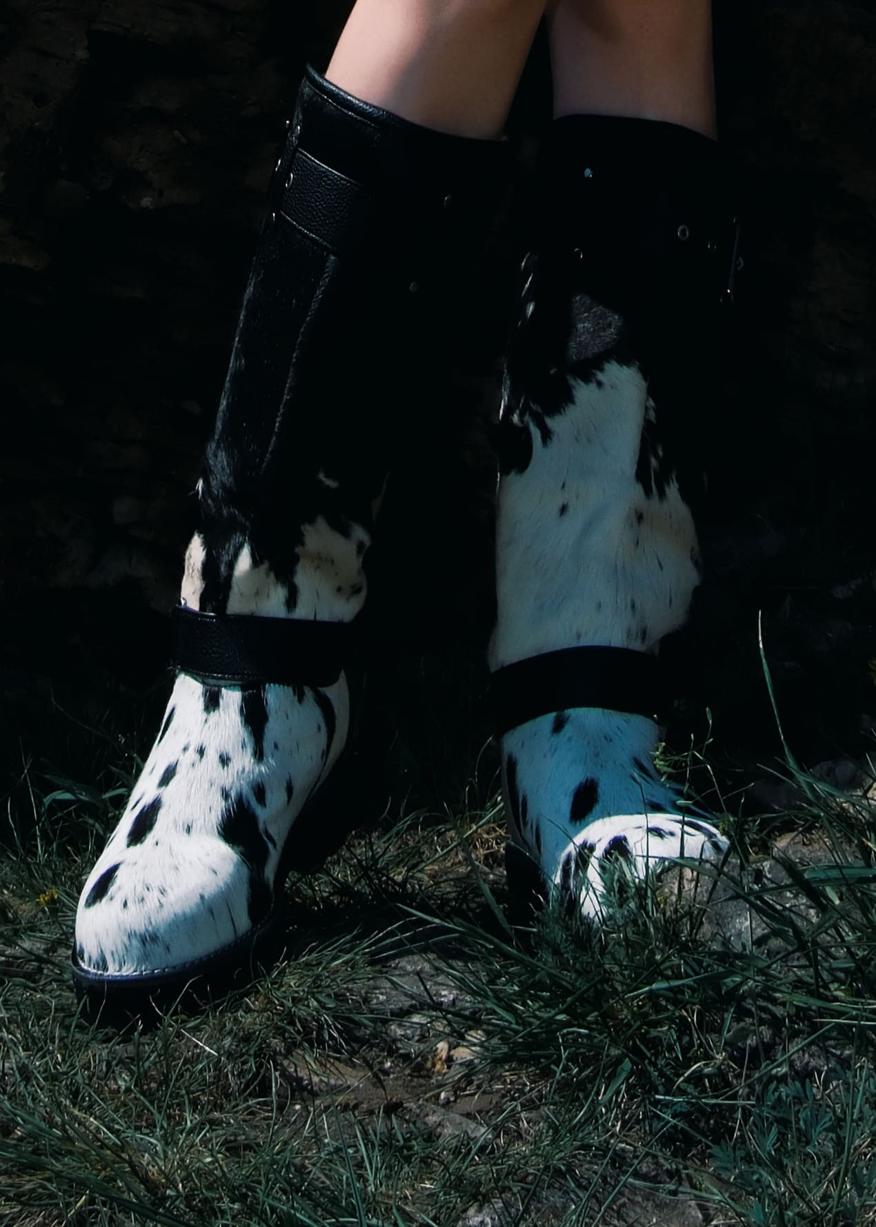 MOGSki handcrafted cowhide snow boots worn outdoors, luxury natural hide Mongolian winter footwear lifestyle photography