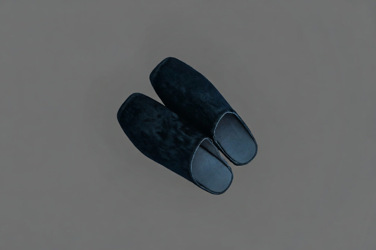 MOGSki natural dark mink fur clogs lifestyle shot, luxury handcrafted genuine fur footwear from Inner Mongolia