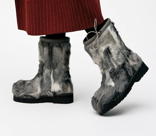 MOGSki natural fur tall boots worn with dark trousers, luxury handcrafted Mongolian winter footwear lifestyle shot