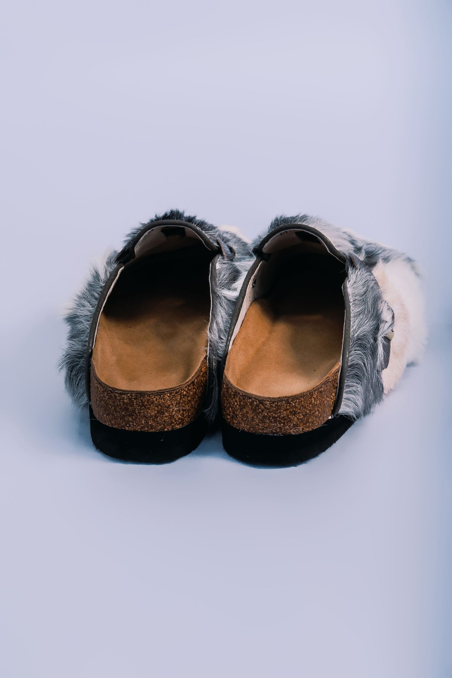 MOGSki handcrafted natural fur sandals side view on clean background, luxury genuine hide spring summer footwear Inner Mongolia