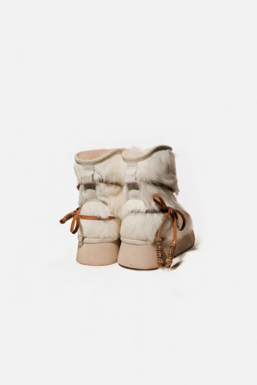 MOGSki natural sheepskin ankle boots pair showing texture, luxury handcrafted Mongolian footwear warm neutral colorway
