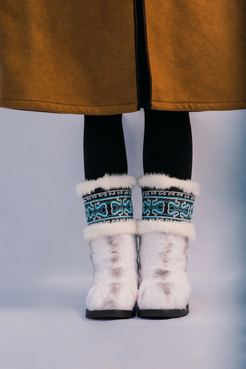 MOGSki cozy white mink fur snow boots worn with warm winter styling, natural fur luxury handcrafted Mongolian footwear