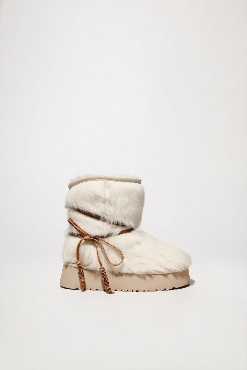 MOGSki natural sheepskin sand-tone ankle boot product shot, luxury handcrafted Mongolian footwear on clean background