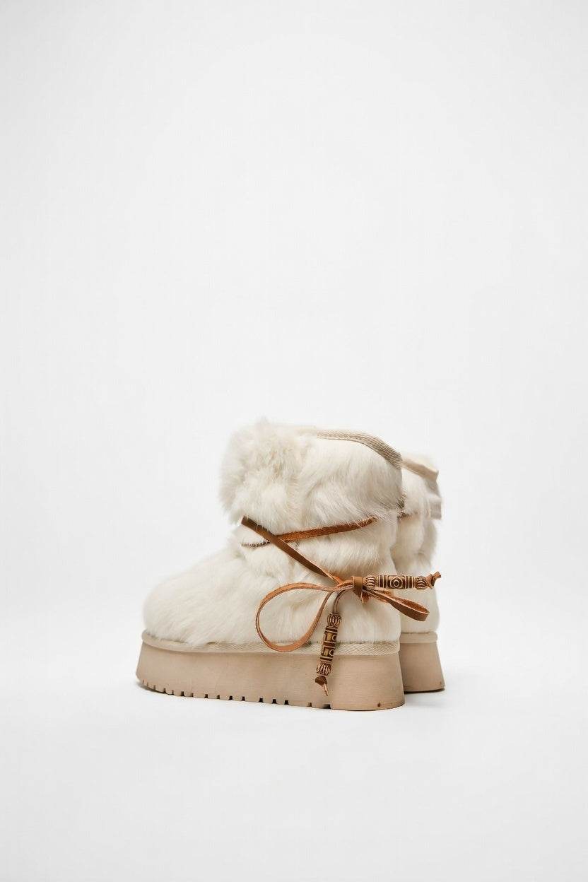 MOGSki handcrafted natural sheepskin ankle boot side view, luxury artisan footwear from Inner Mongolia product photography